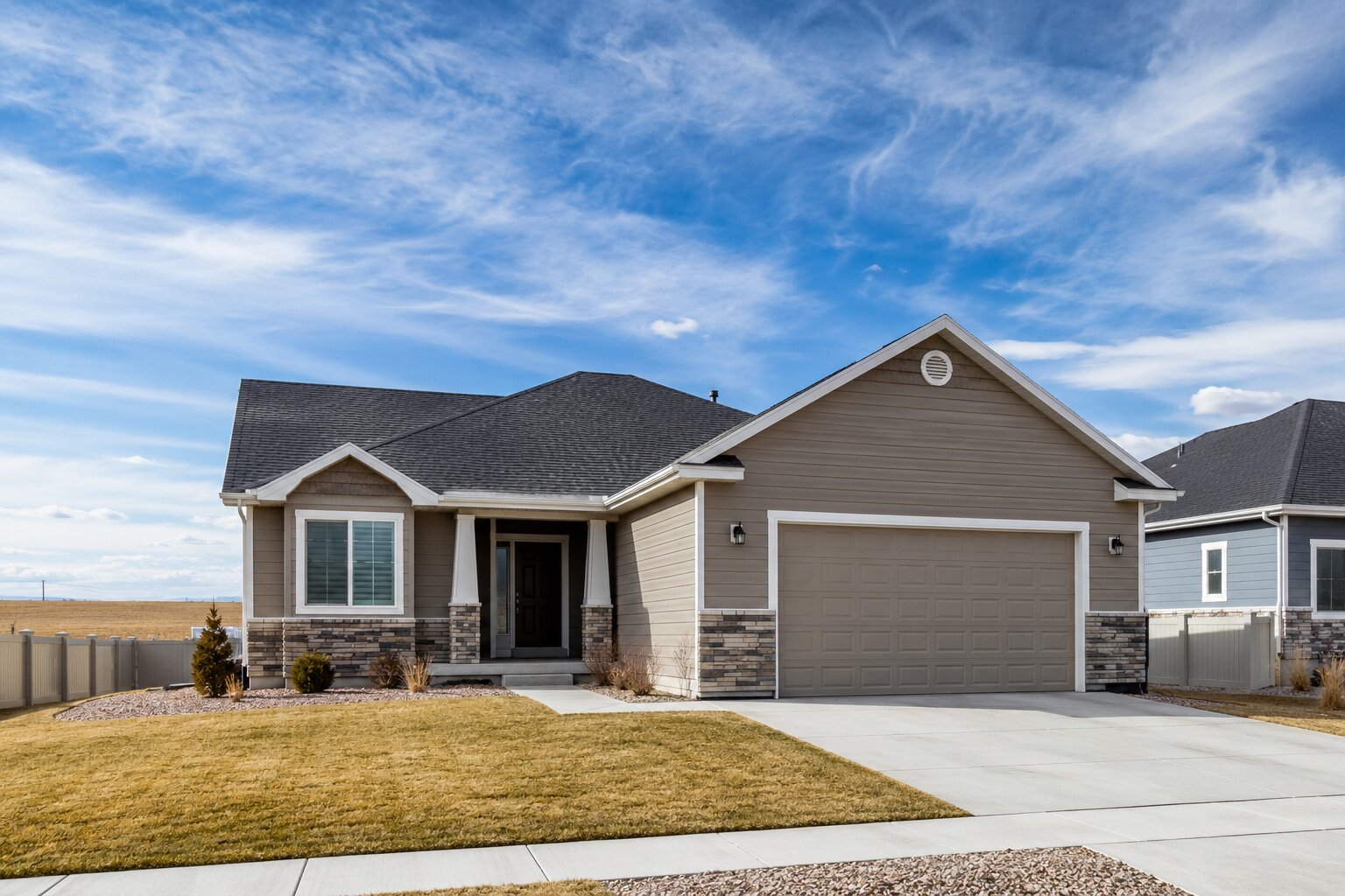 Single-story home exterior on flat, open terrain typical of a Cheyenne, Wyoming neighborhood.